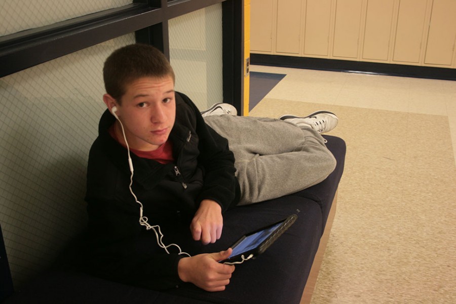 Ian Casey works on his homework in the halls while his class goes over the test he missed.