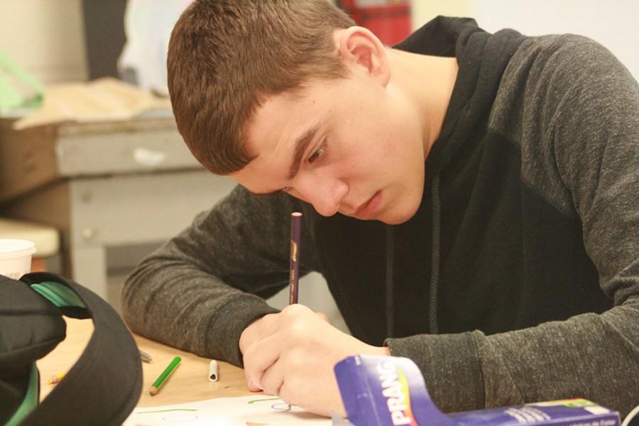 Brandon Romano diligently works during art class.