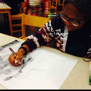 Lauren Kennedy works on a drawing for class.  