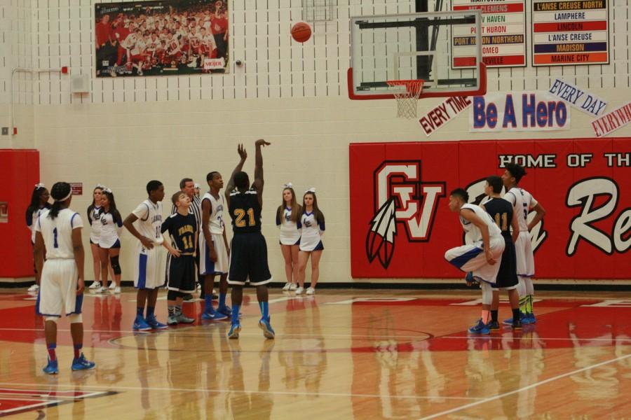 Shawn Jackson (21) shooting and making one of his many free throws against LAnse Creuse.