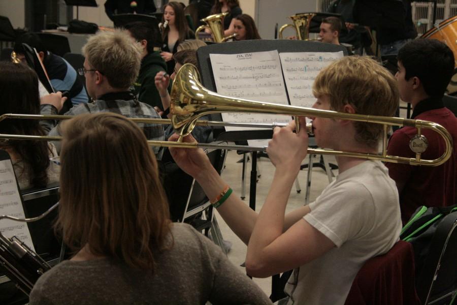 Freshmen Nathan Wilson hold his trombone at a perfect ninety degree angle.