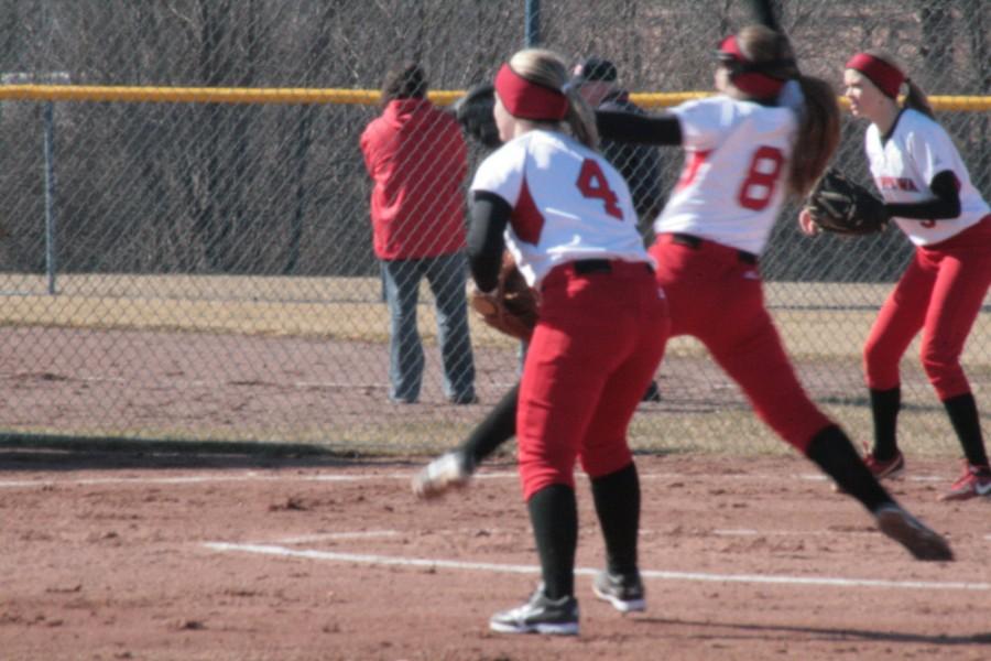 Chippewa pitcher Laura Miller (#8) throwing during the first inning against the Ramblers.