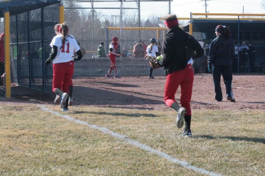 Some of the players on Chippewa running between innings as they try to stay warm.