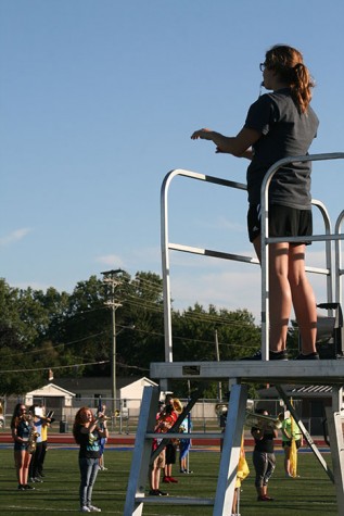 Emma Chrzanowski, one of the four drum majors, leads the band in Theme from Spider Man.