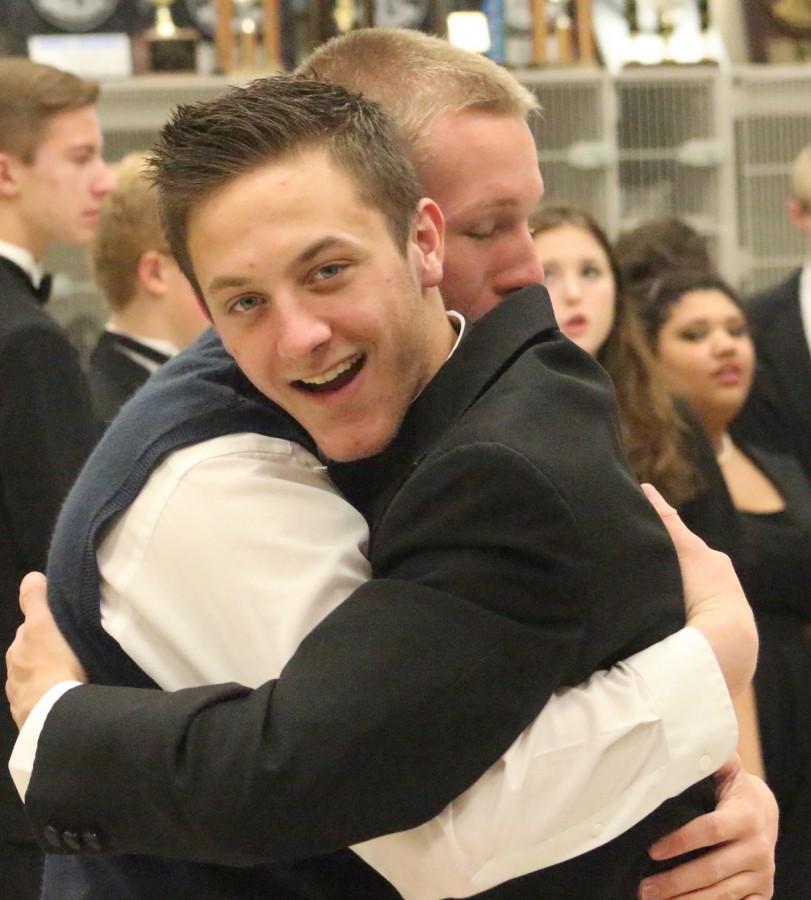Conner Casey and Tony Federico hug it out before the last winter concert.