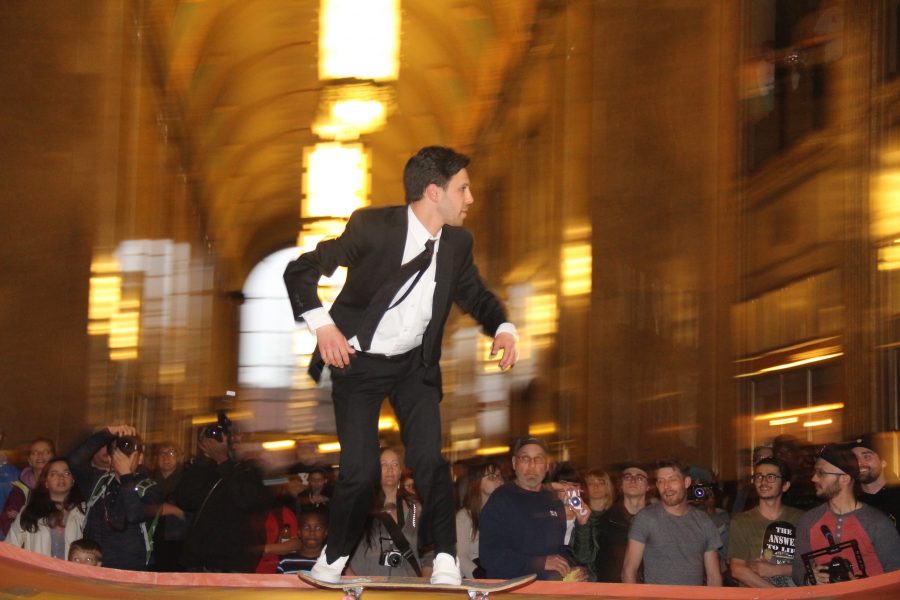 A sharp dressed skater shows off his style and flair while skating the halfpipe Monday on night.