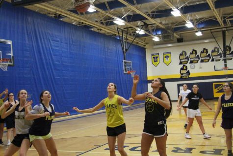 The girls varsity basketball team boxing out and defending the paint hard in practice as they prepare for the Lancers of LAnse Cruise on December 4th. 