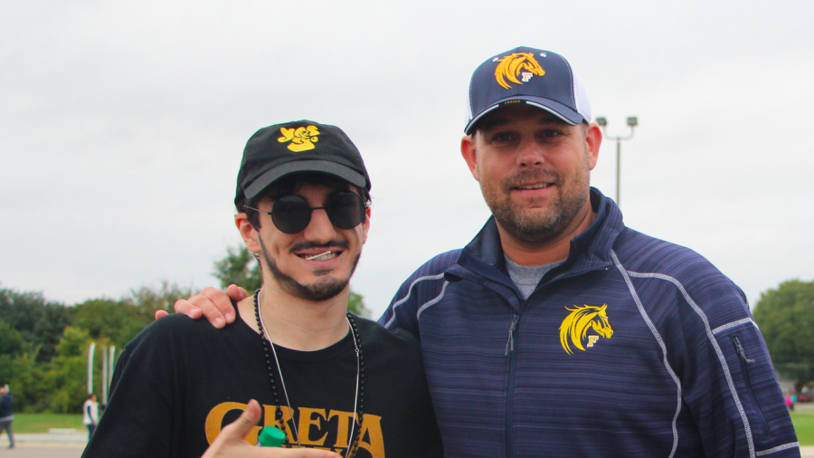 Principal Ryan Sines with Peter, a senior, during homecoming.