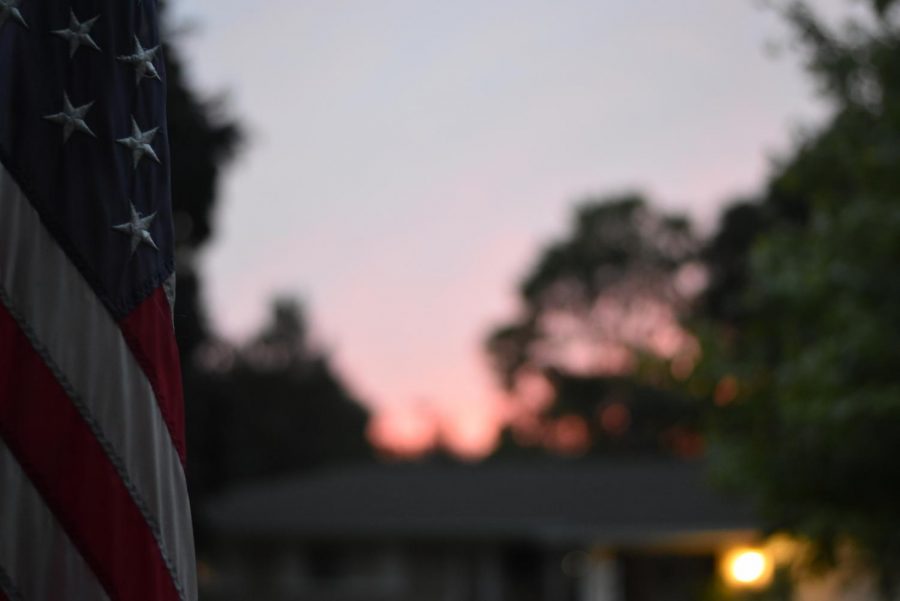 An American flag during an early fall sunset.