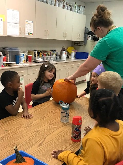 preschoolers playing with pumpkins during future teacher visits