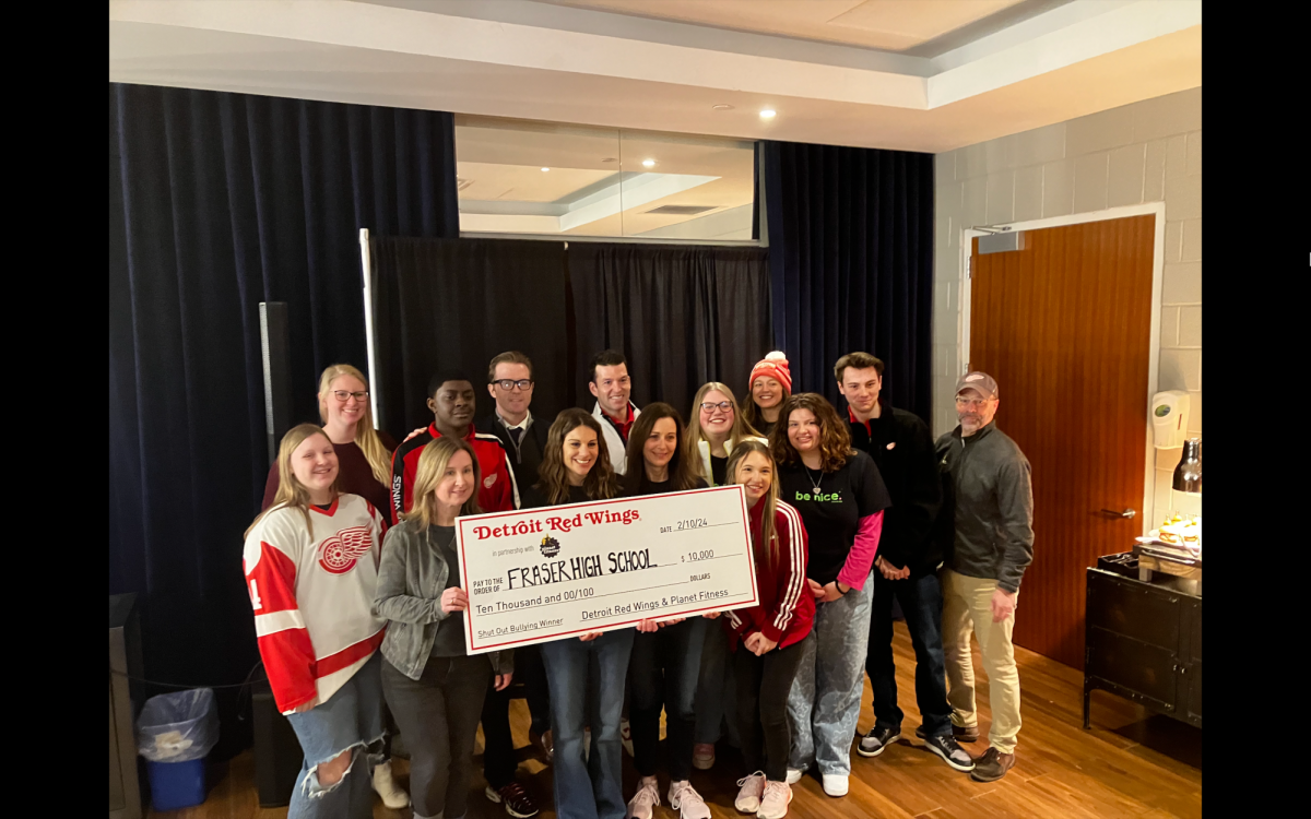 The FHS Be Nice club receiving their check