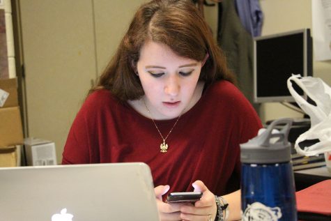 Senior Shelley Sawyer is on her phone, with a little bit of free time at the end of class Shelley sends a text. Shelleys phone provider is AT&T. Shelley sends about 100 text in a day.