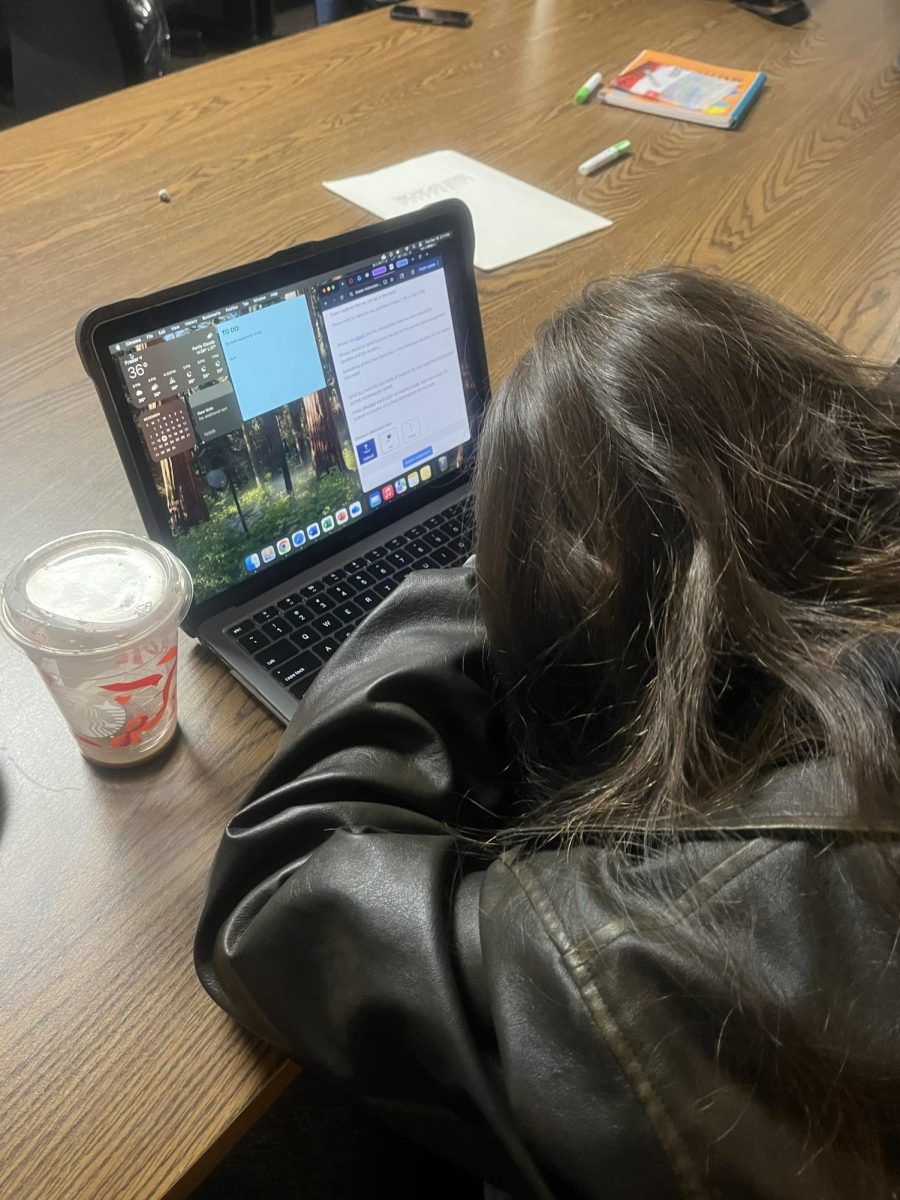 Student asleep at her desk after a long day of school. 