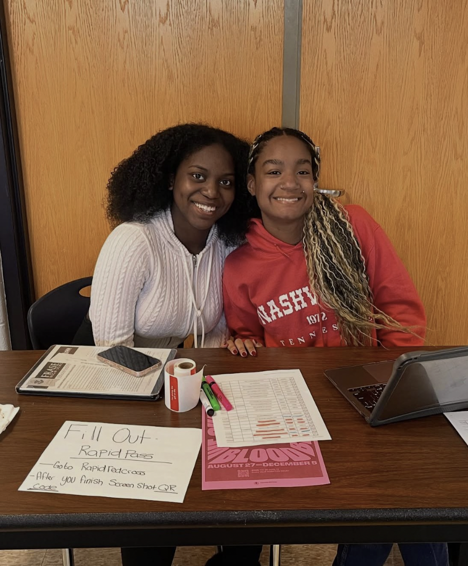 Two HOSA members working the fall blood drive.